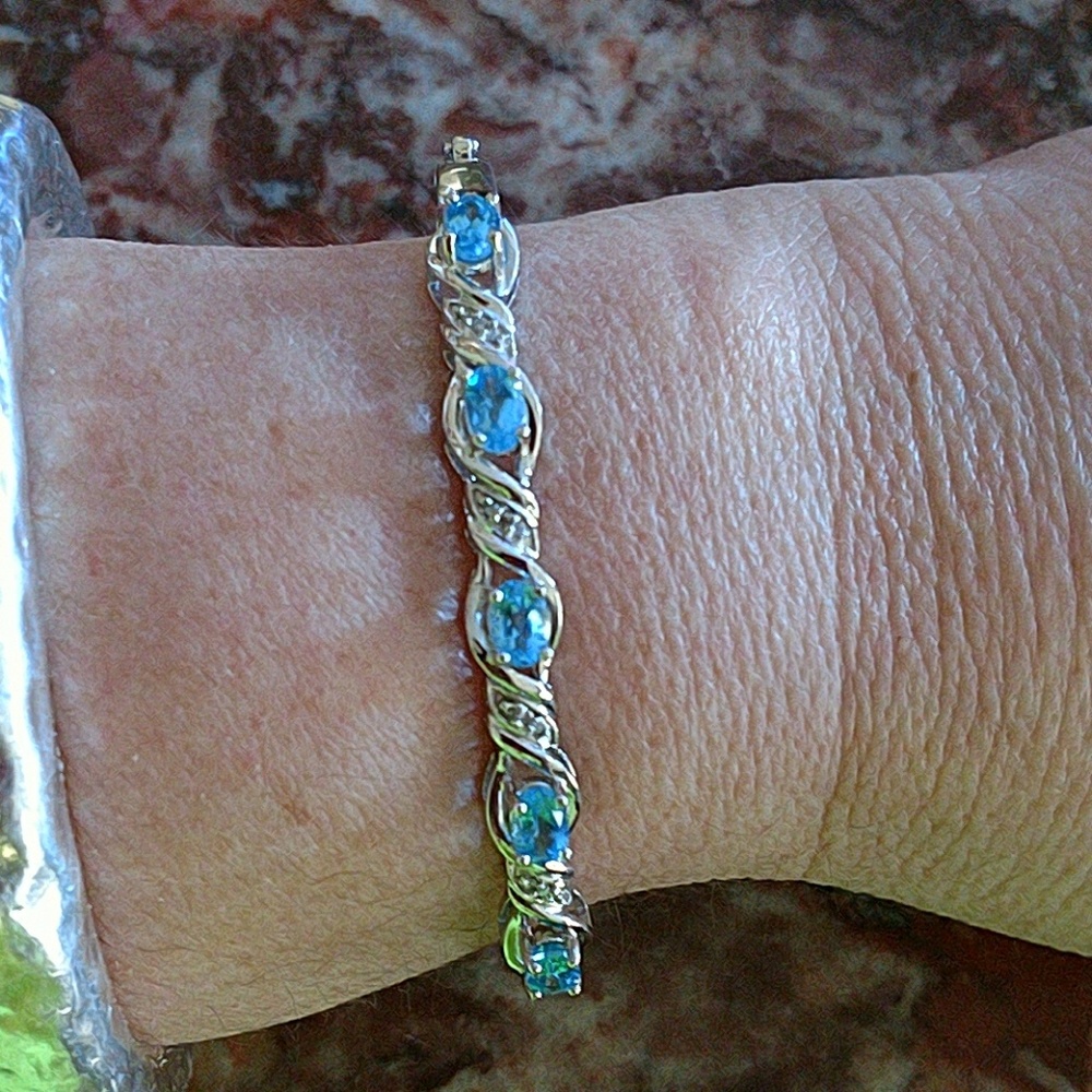 Sterling platinum blue topaz diamond bracelet